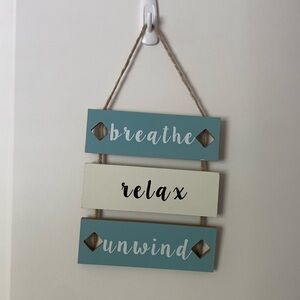 This is a 3 penal wooden sign.